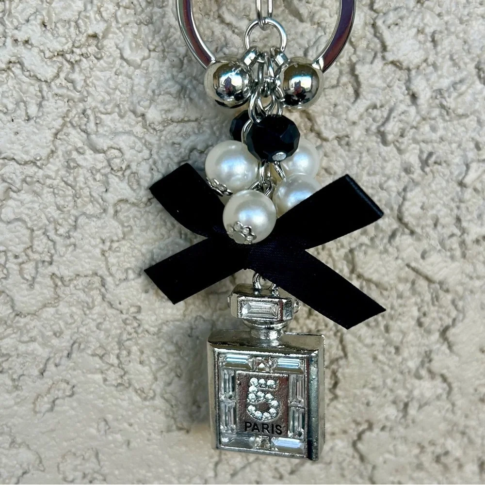 Luxe Silver Perfume Bottle Keychain/Bag Charm with Black Bow